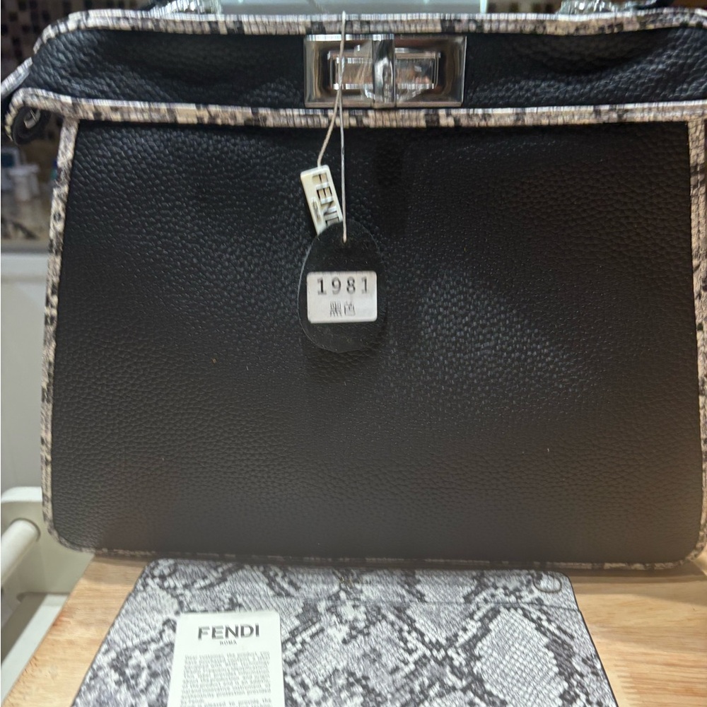 Fendi Black and Cream Crossbody Bag This bag was bought at Belk’s on clearance .